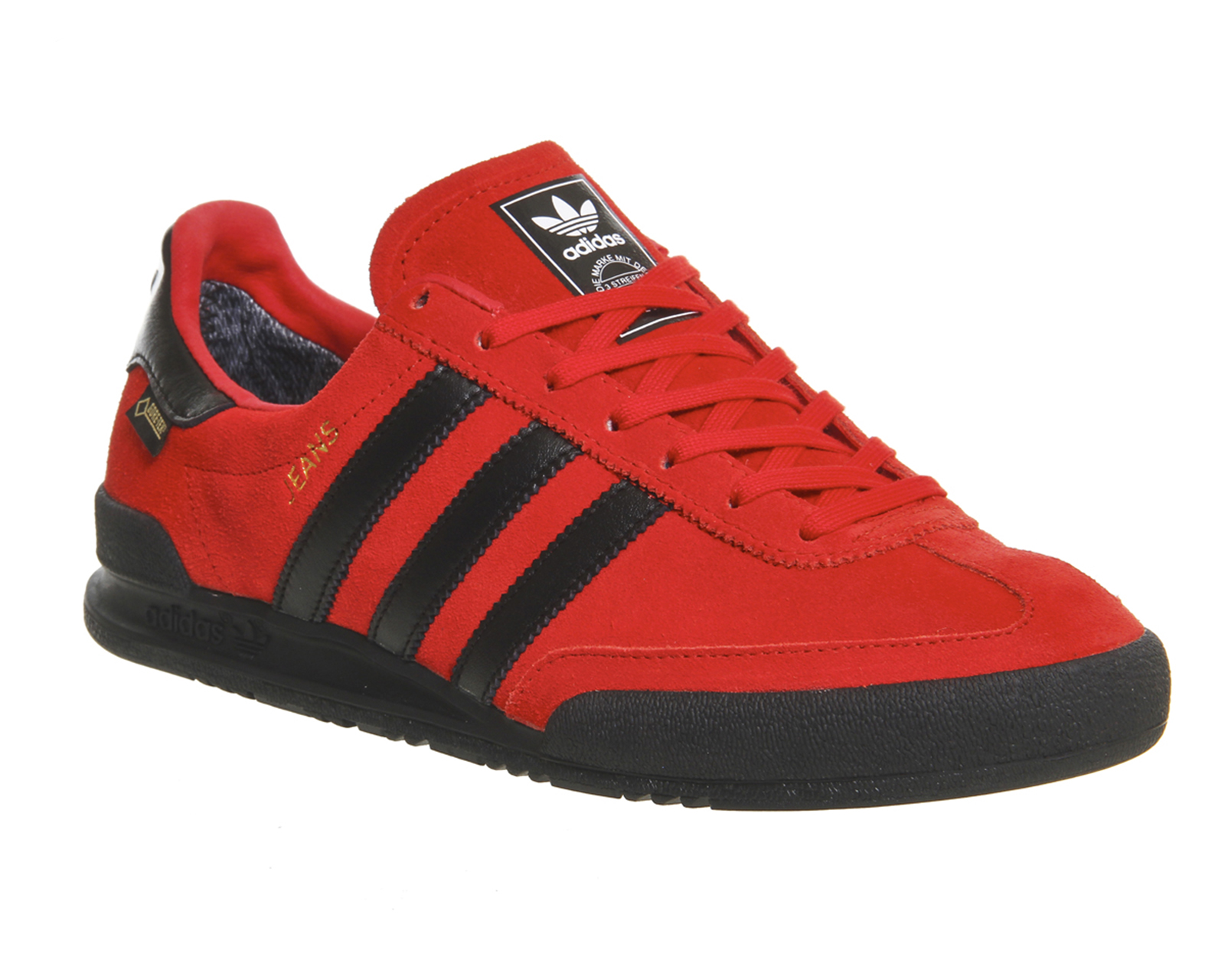 red and black adidas trainers